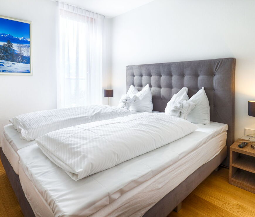 Residence Bellevue Zell am See: Schlafzimmer mit Doppelbett